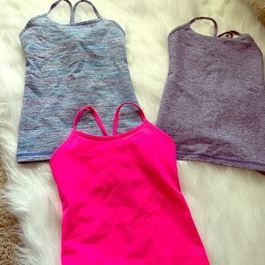 Three girls size 7 Ivivva tanks
